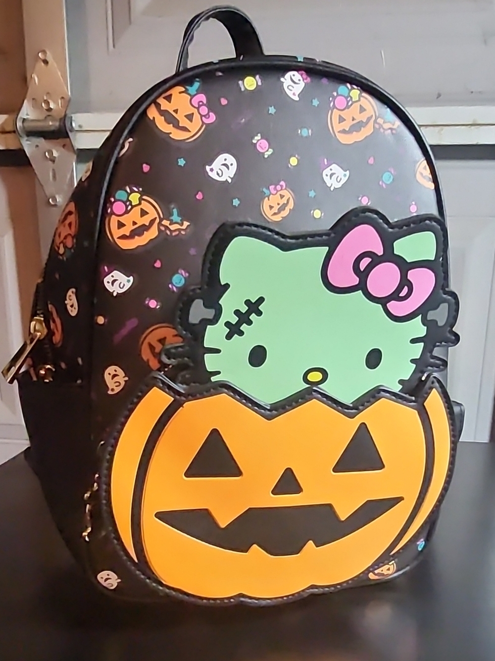 Hello Kitty Black Backpack with Green Character and Orange Pumpkin